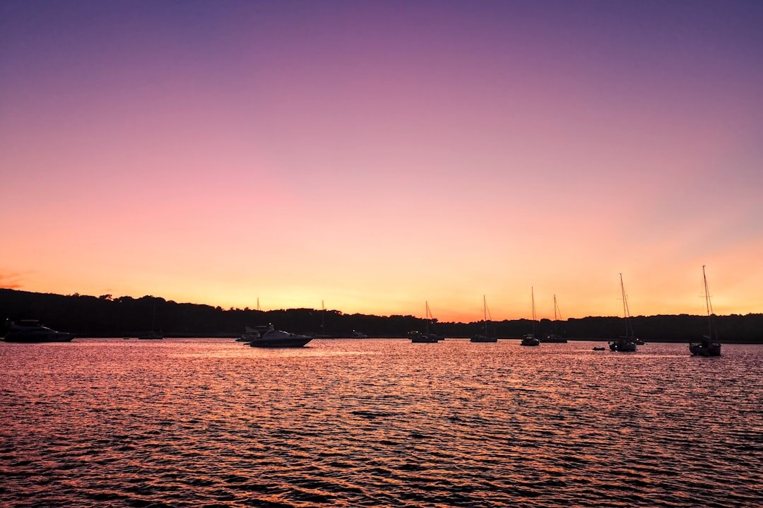 yacht on sea at sunset